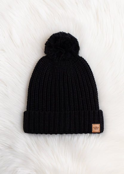 Adorable black slouchy knit beanie with matching pom accent